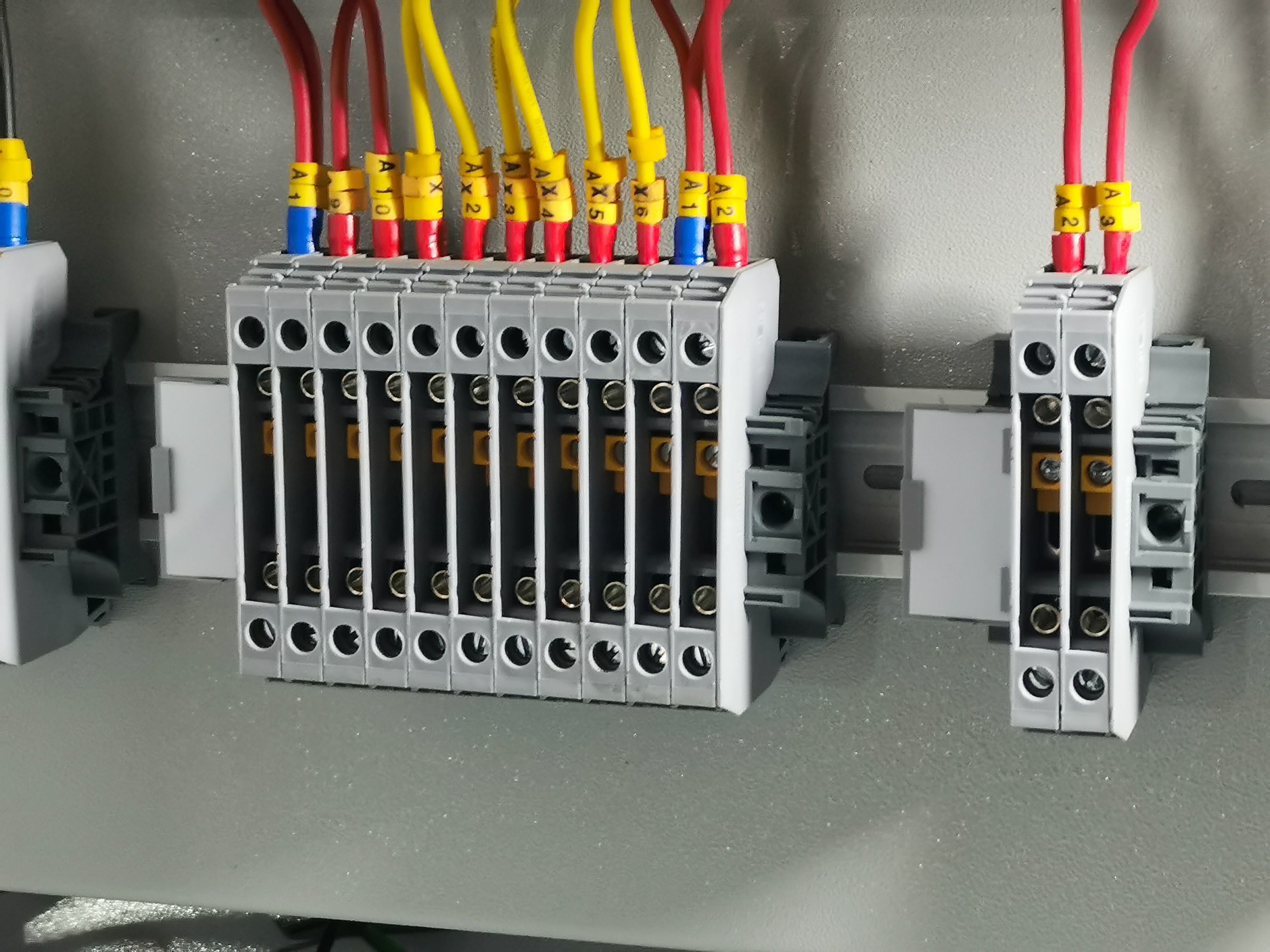 A row of terminal blocks in electrical cabinet.